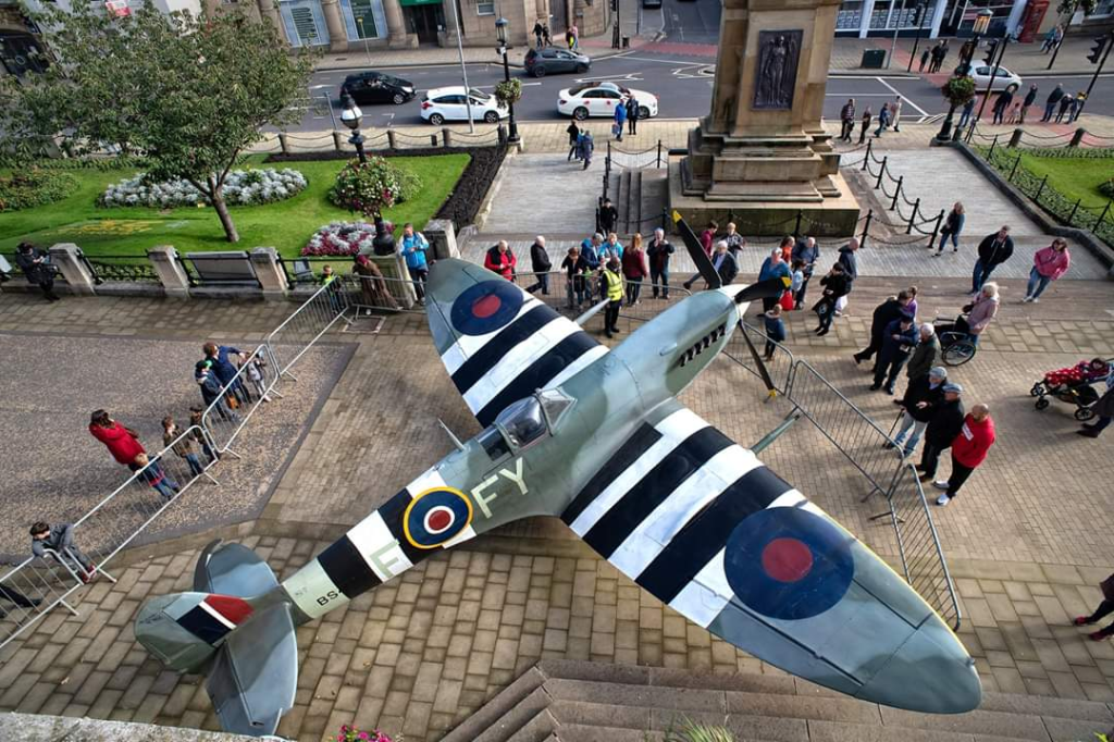 a full size spitfire outside the town hall