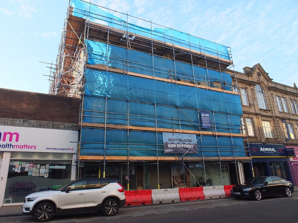 Photograph of the YMCA covered in scaffolding